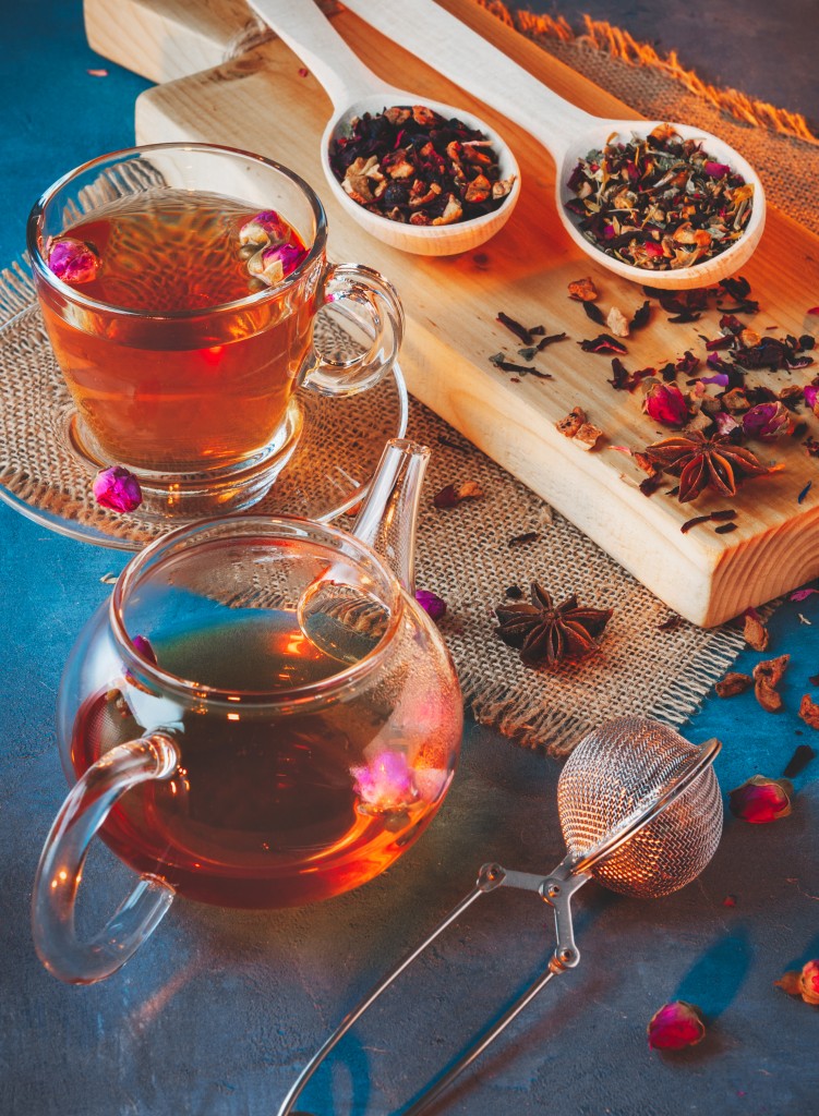 Tea Ceremony,a Cup Of Freshly Brewed Black Tea And Glass Teapot, Different Types Of Tea, Spices And Dried Roses